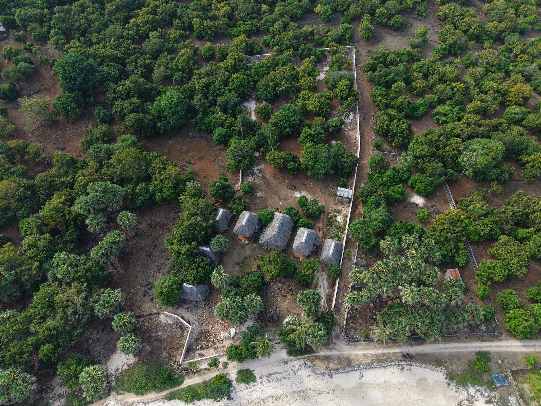 Overhead aerial of the parcel showing the full reinforced stone perimeter wall