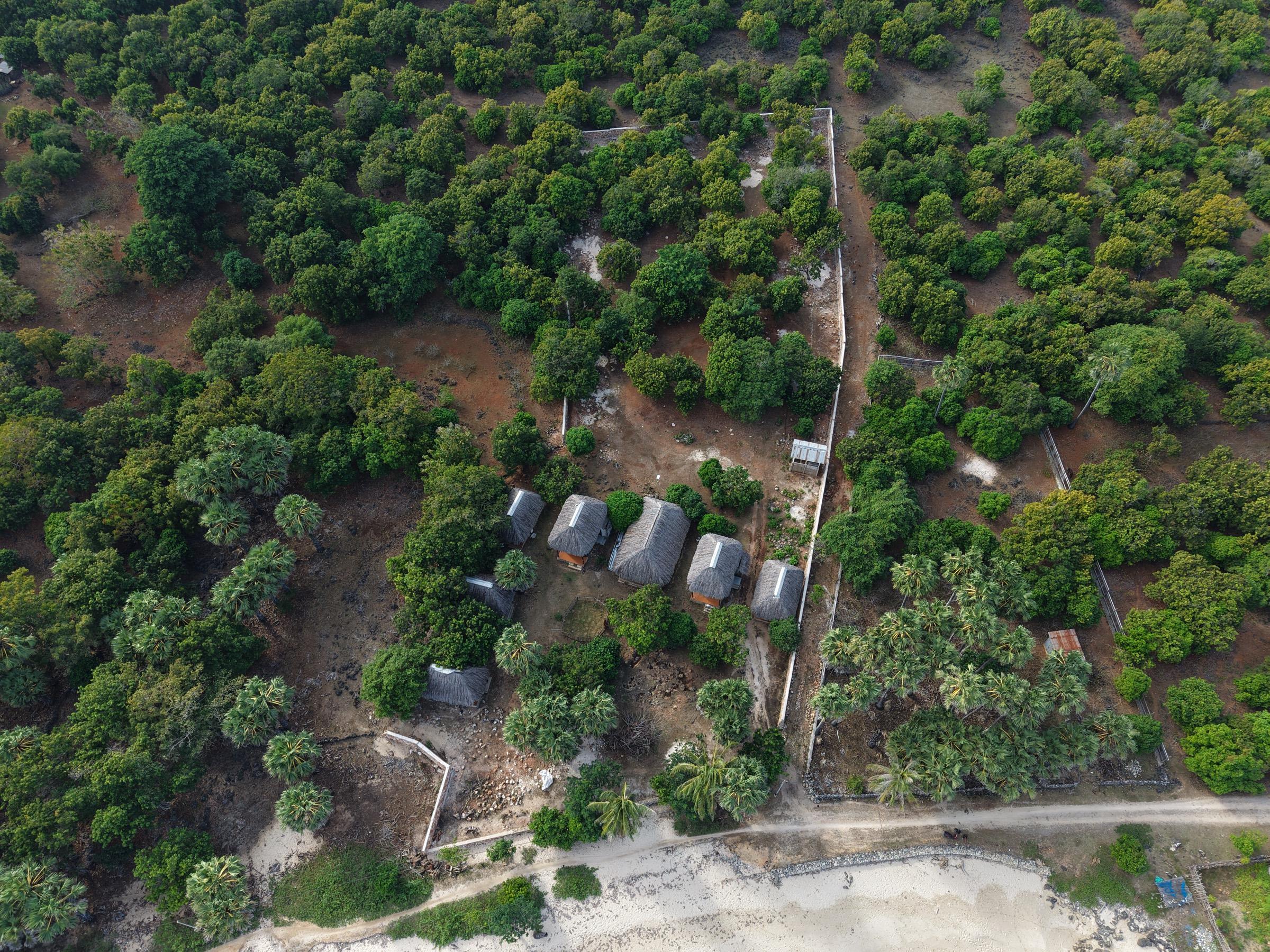 Overhead aerial of the parcel showing the full reinforced stone perimeter wall
